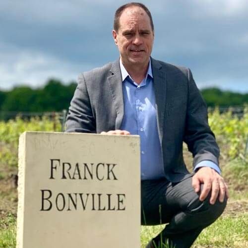 Kevin Carl, Specialty Importer, standing beside Franck Bonville monument